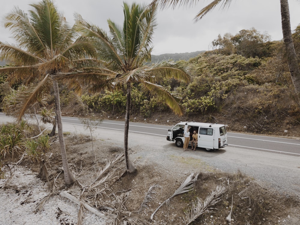 white and black truck on gray sand during daytime