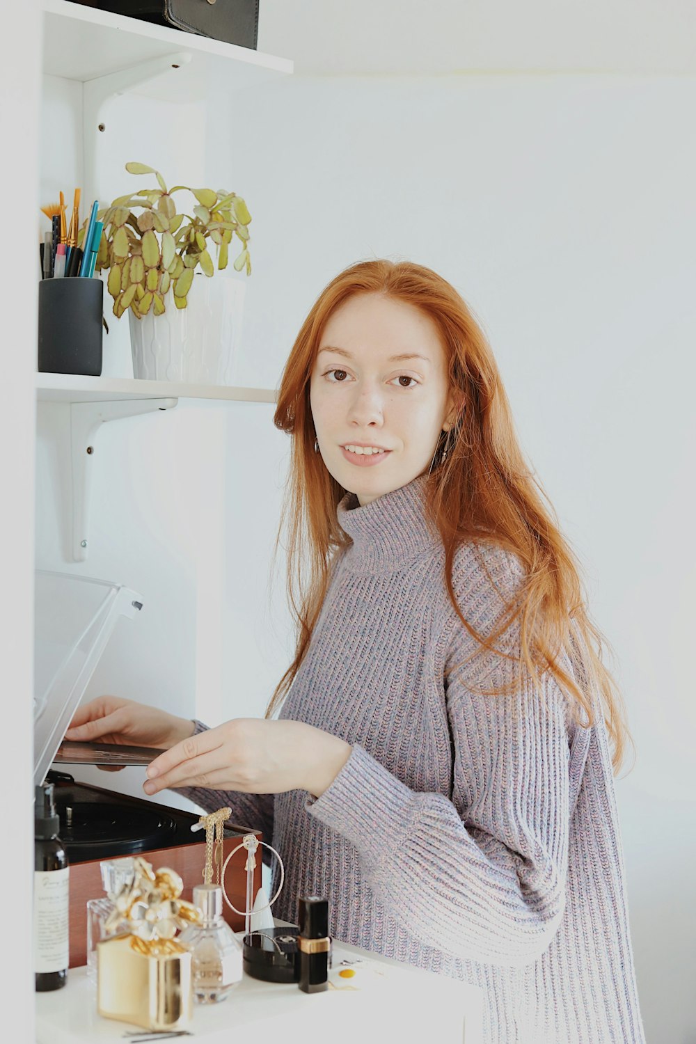 woman in gray and white long sleeve shirt