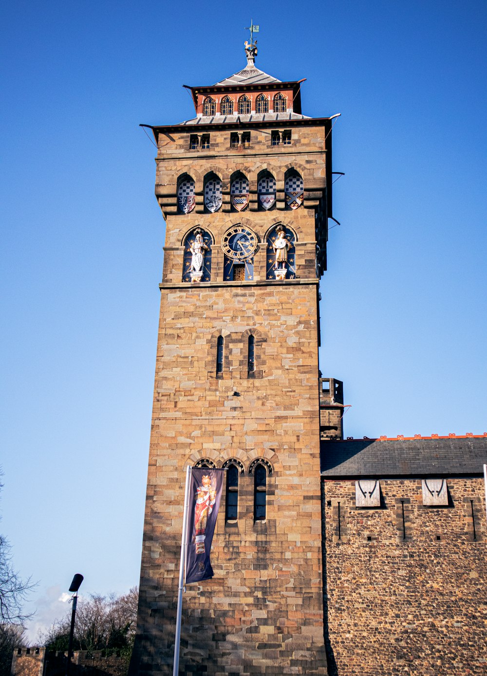 brown brick building under blue sky during daytime