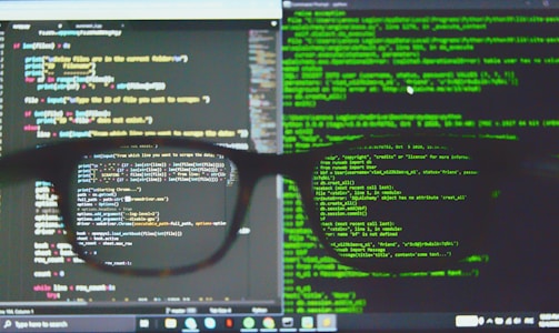 black framed eyeglasses on computer screen