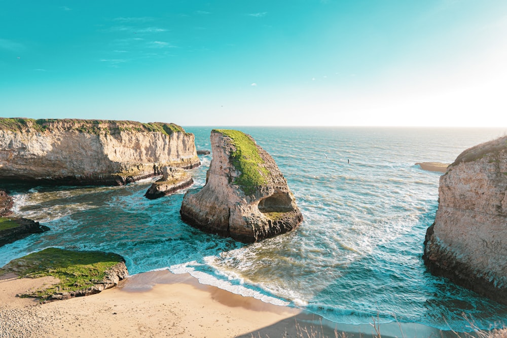 brown rock formation on sea shore during daytime