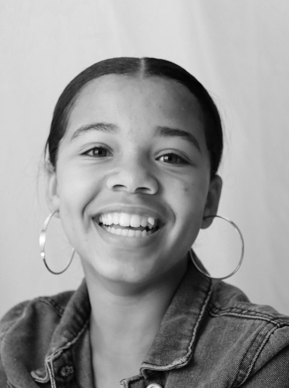 grayscale photo of smiling boy