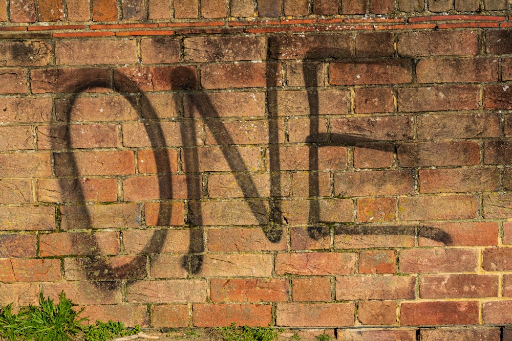 brown brick wall with green grass