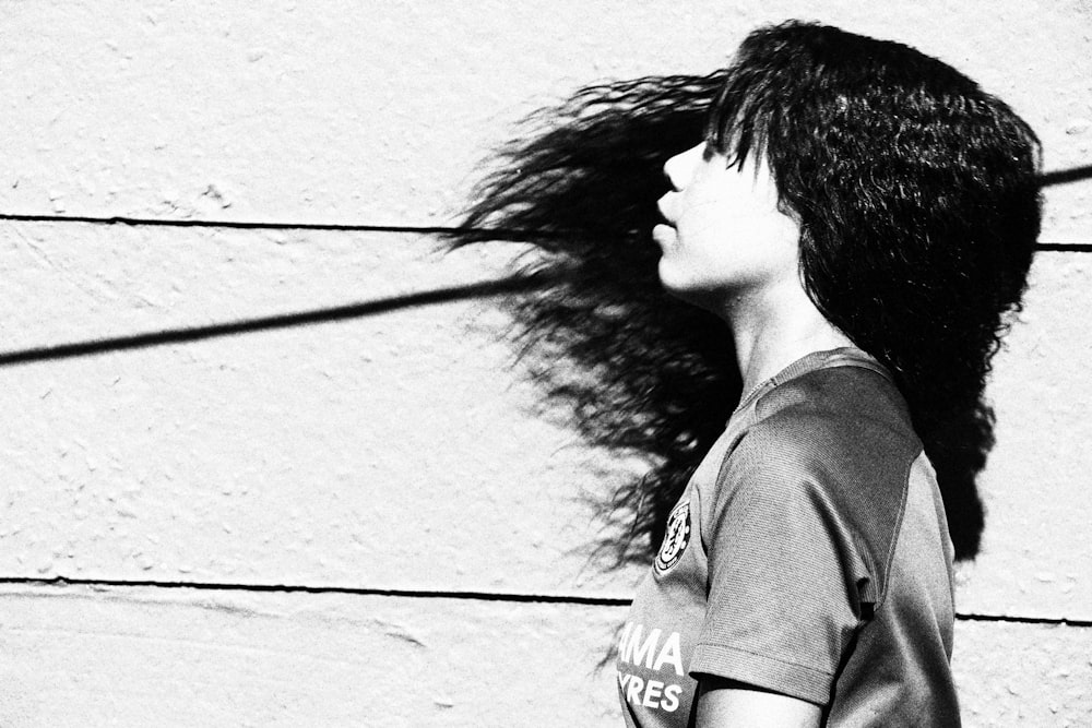 grayscale photo of woman in v neck shirt