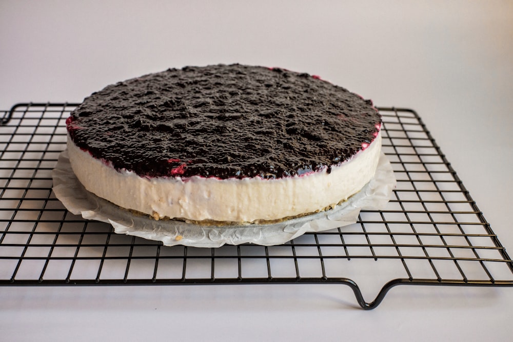 chocolate cake on white metal rack