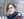 girl in black framed eyeglasses and black jacket
