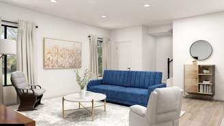 blue sofa near white wall
