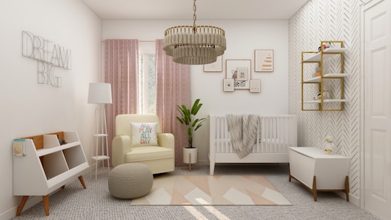 A beautifully designed nursery with a modern minimalist style. The room features a white crib with a gray blanket, a comfortable beige armchair with a colorful pillow, and a matching pouf. Light pink curtains cover the window behind the armchair. A geometric rug with soft pastel tones lies on the floor. The walls are decorated with herringbone wallpaper, artistic frames, and the words 'Dream Big' in wire art. A chic chandelier hangs from the ceiling, and there is a touch of greenery from a plant in the corner. Storage units hold books and toys.