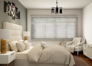 white bed near white window blinds