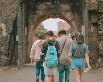 man and woman walking on pathway during daytime