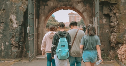 man and woman walking on pathway during daytime