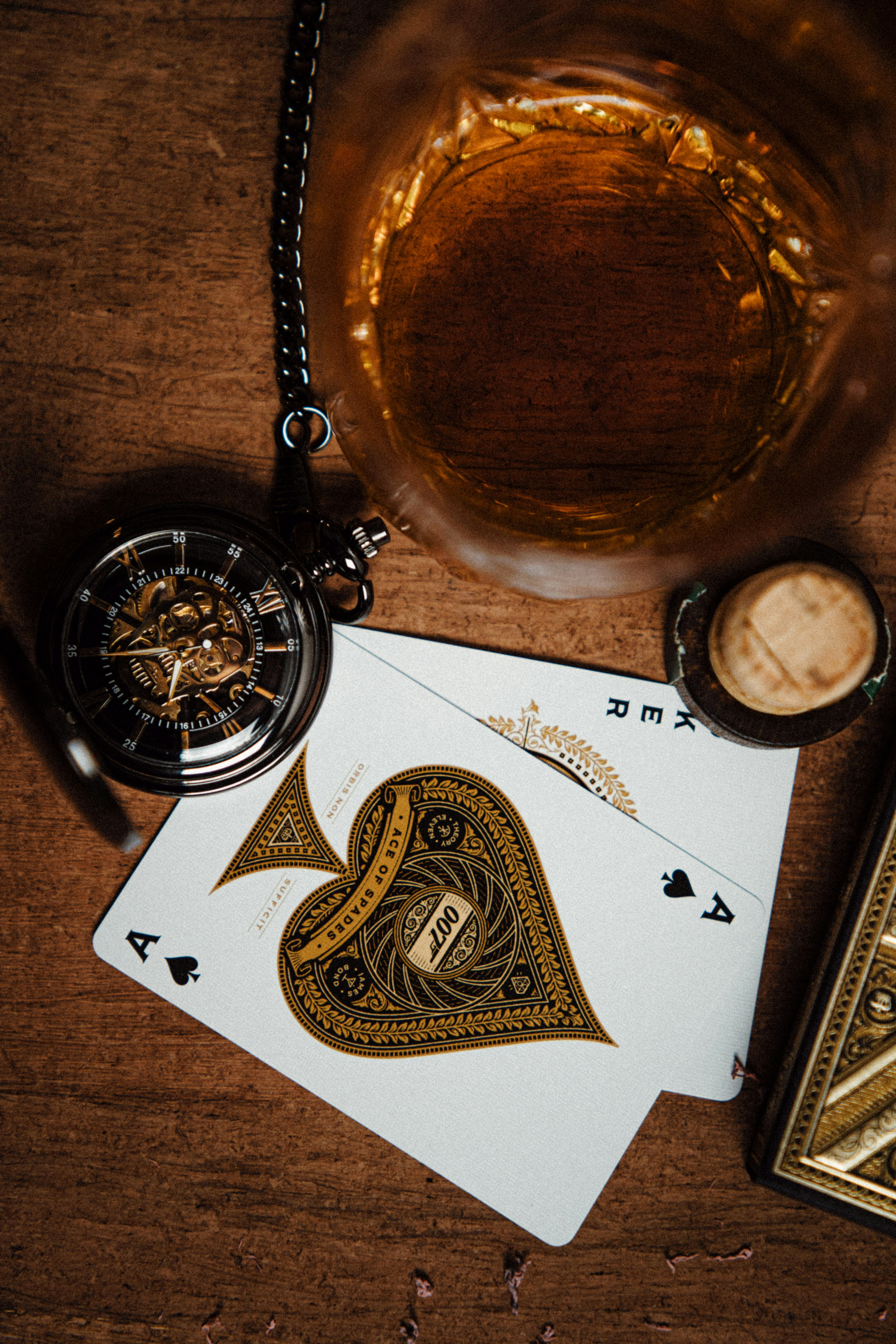 gold pocket watch on white paper