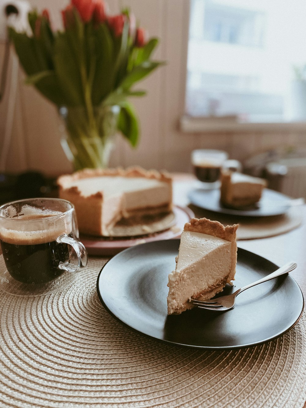 sliced bread on white ceramic plate beside clear drinking glass