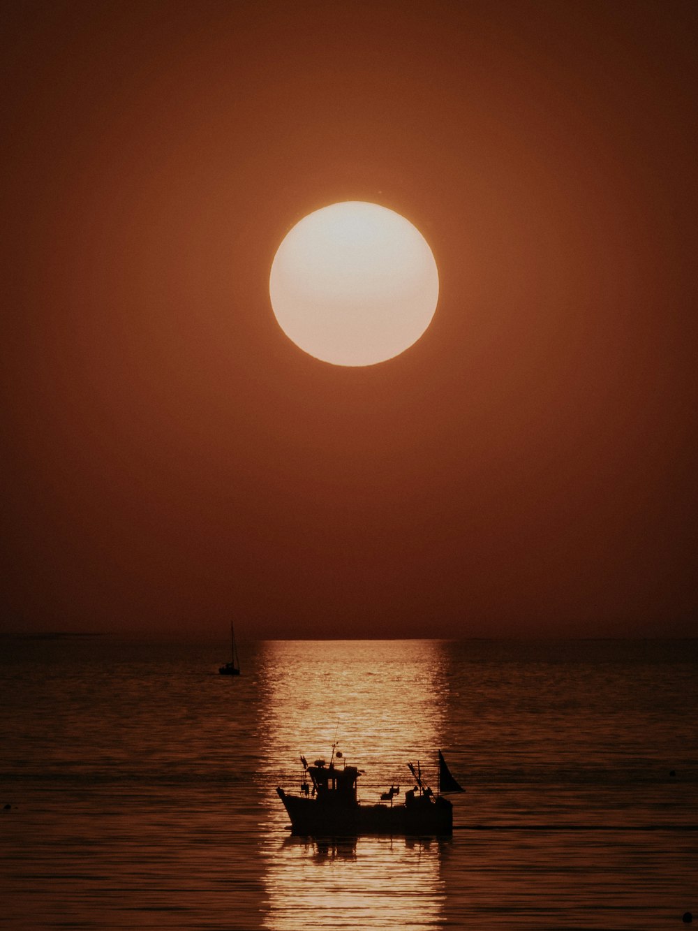 silhouette of people on beach during sunset