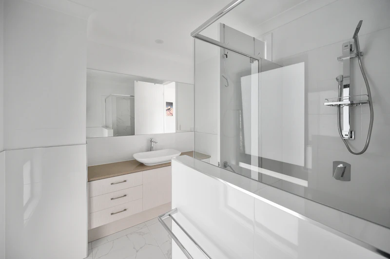 White wooden bathroom cabinet with mirror