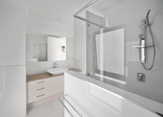 white wooden bathroom cabinet with mirror