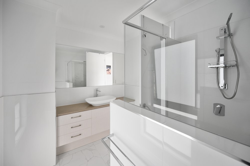 white wooden bathroom cabinet with mirror