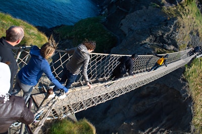 Participants crossing a rope bridge during an adventurous outbound event