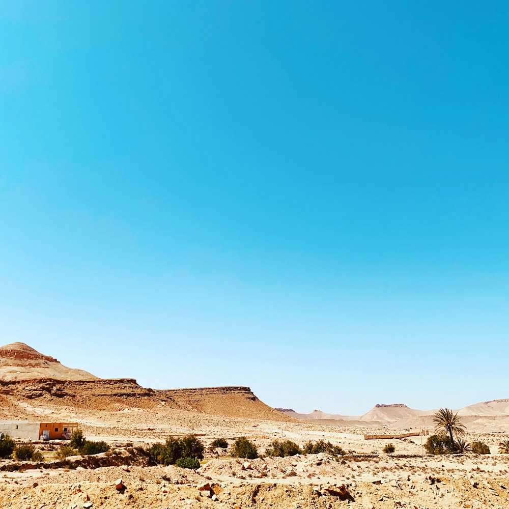 brown rocky mountain under blue sky during daytime