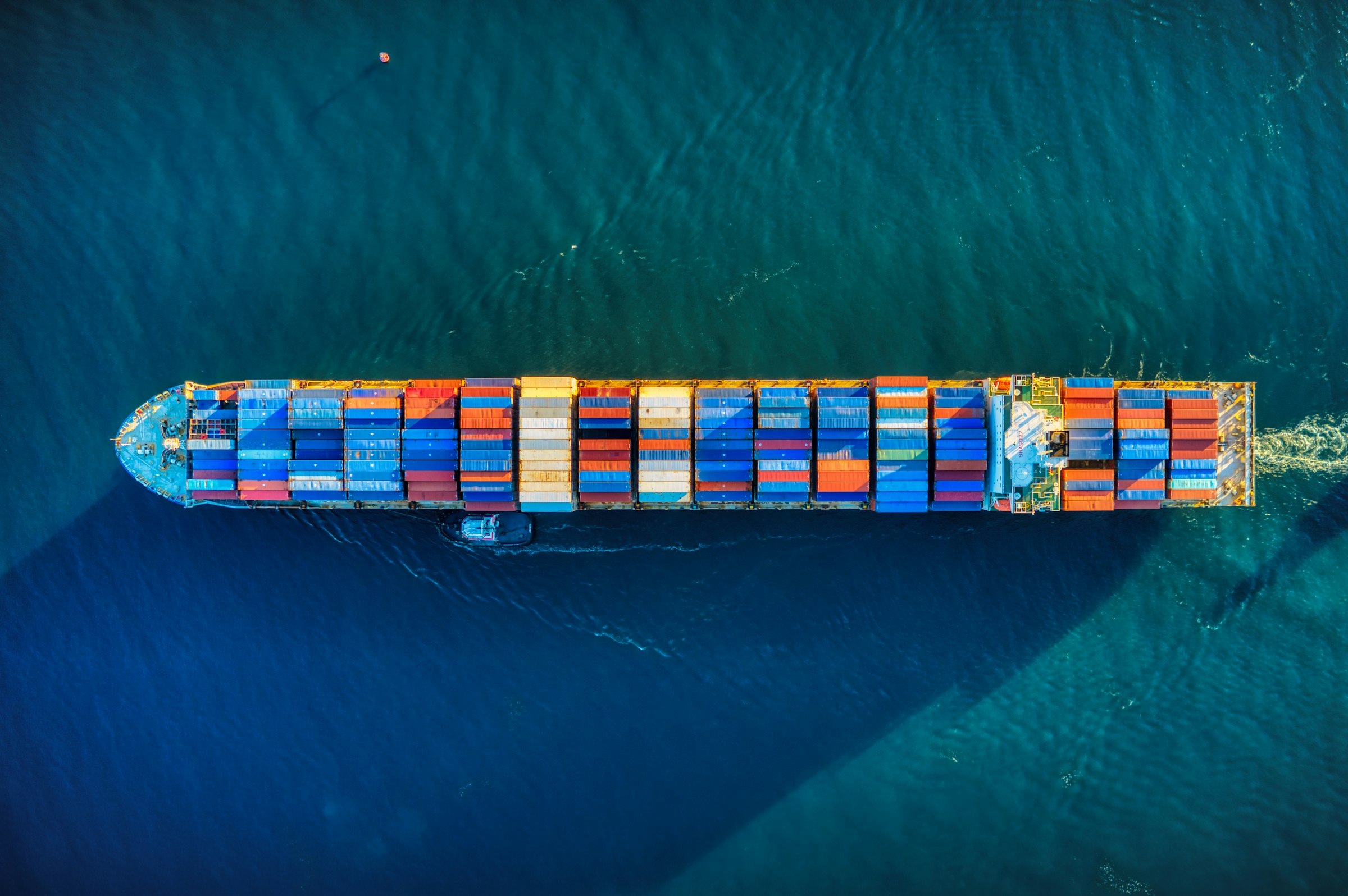Cargo ship crossing the Indian Ocean at dawn