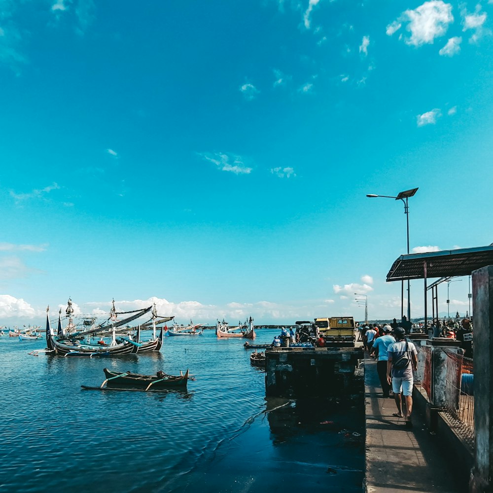 white boat on sea during daytime