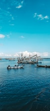 white and blue boat on sea during daytime