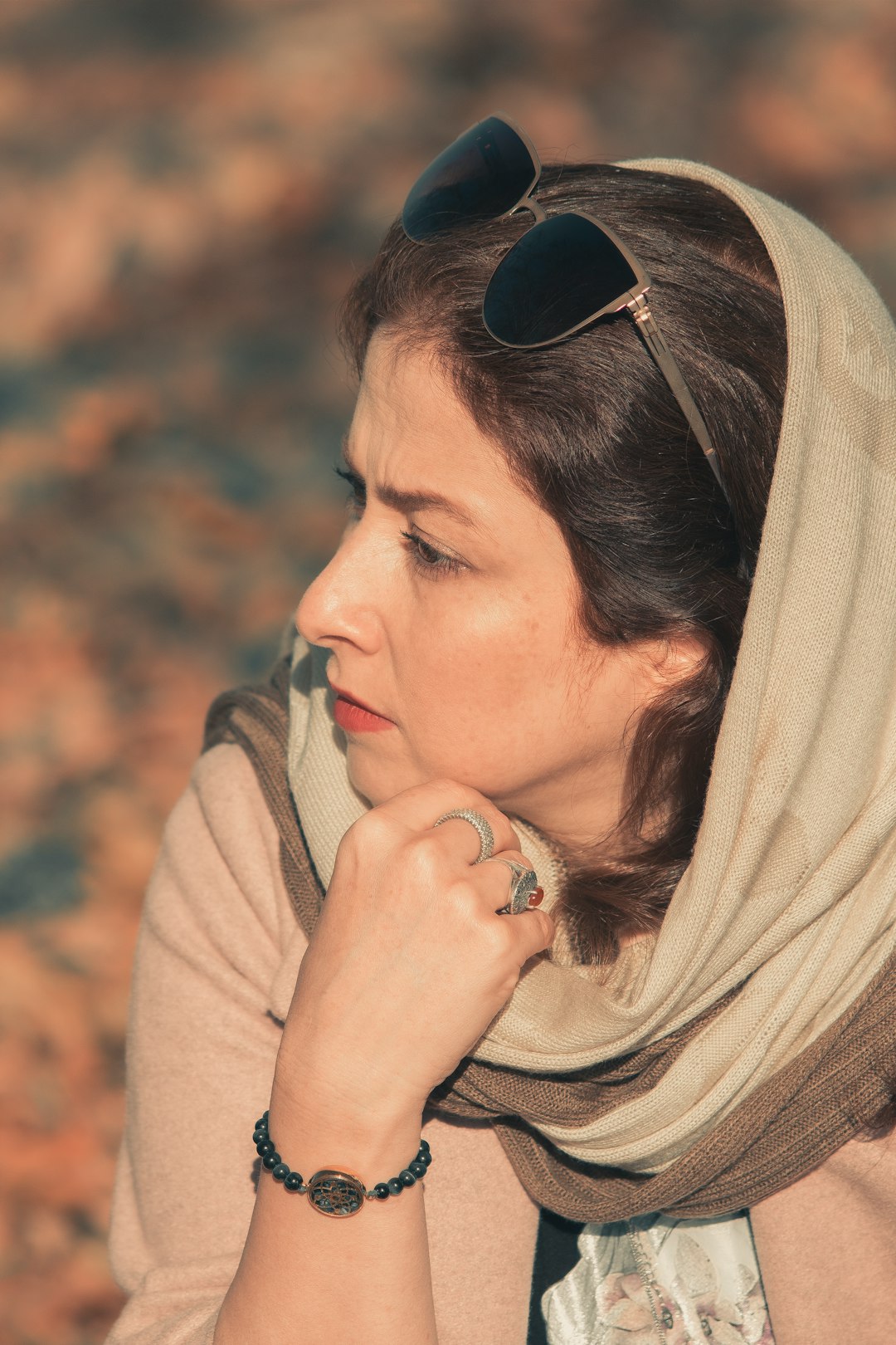 woman in brown scarf and black sunglasses