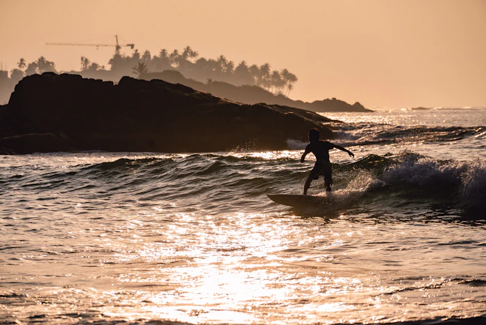 Surfing at sunset
