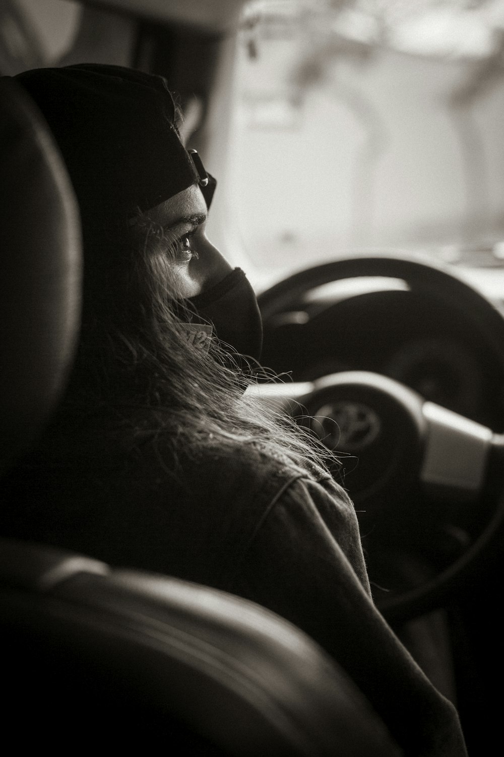 grayscale photo of woman wearing sunglasses