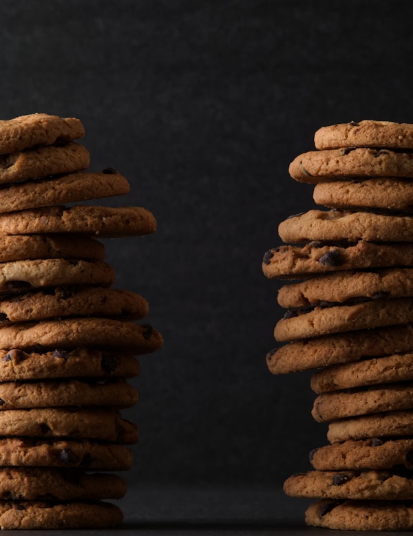 Brown cookies on black surface