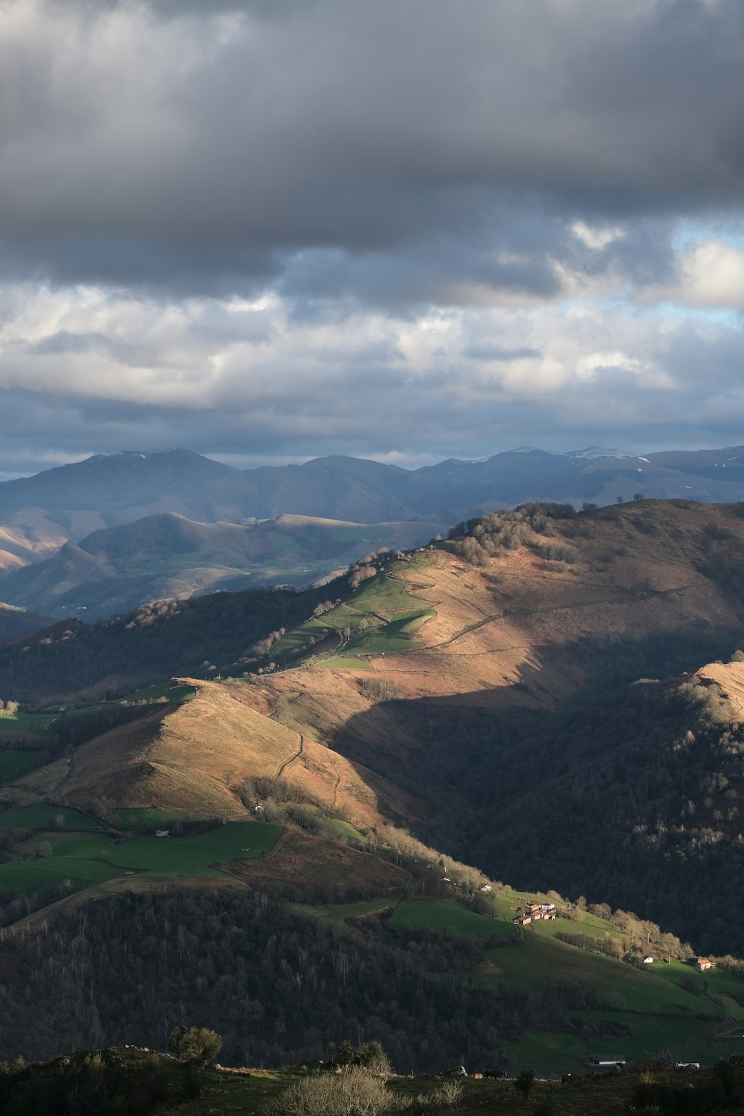 green and brown mountains under white clouds during daytime