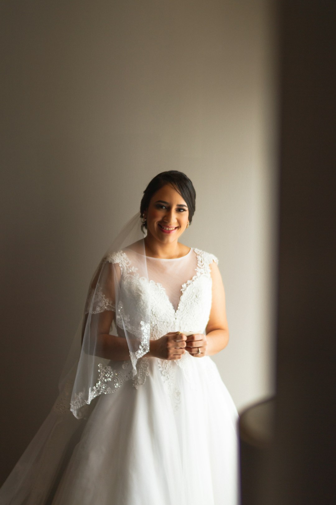 woman in white floral lace wedding dress