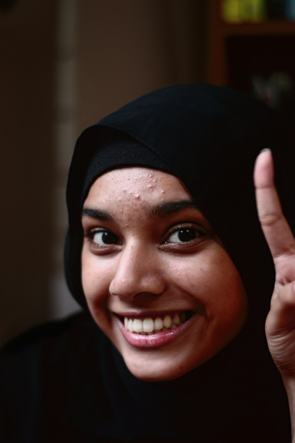 smiling woman wearing black hijab