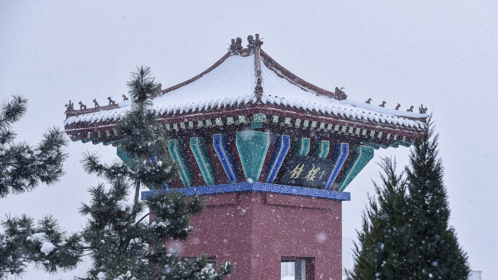 red concrete building with green trees