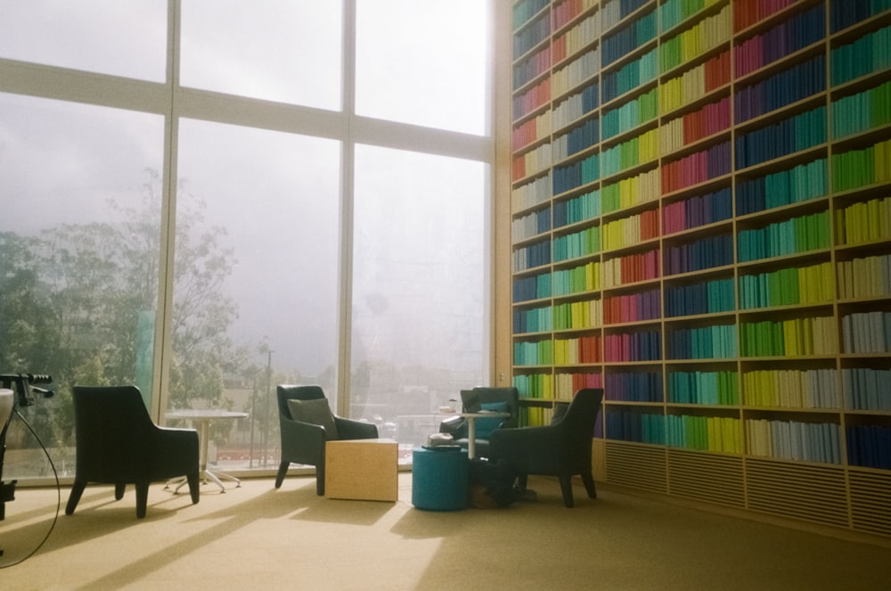 black wooden chairs and table near window