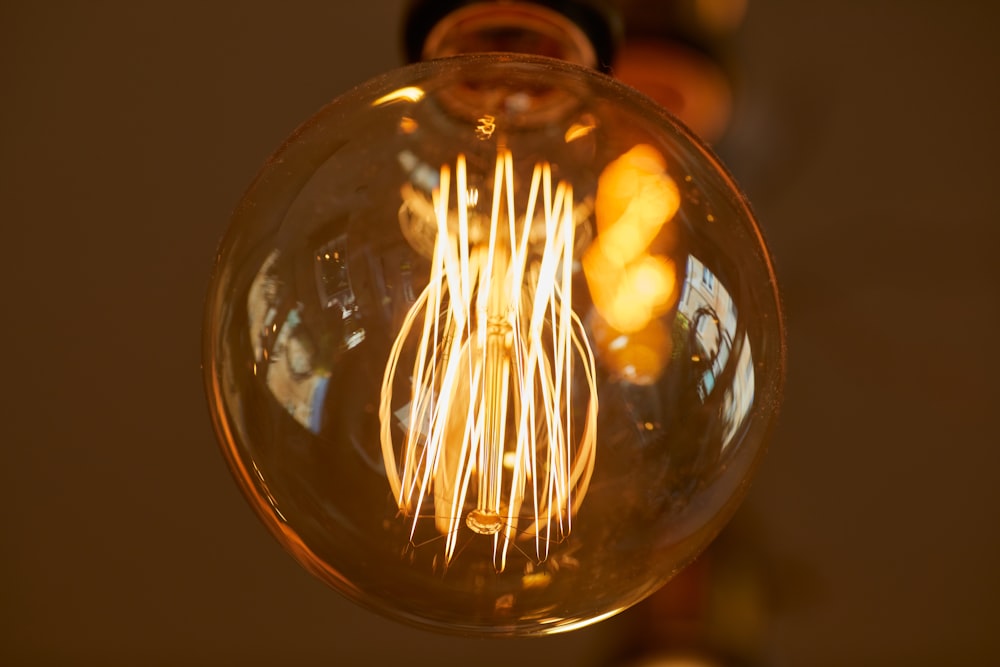 clear glass light bulb with light