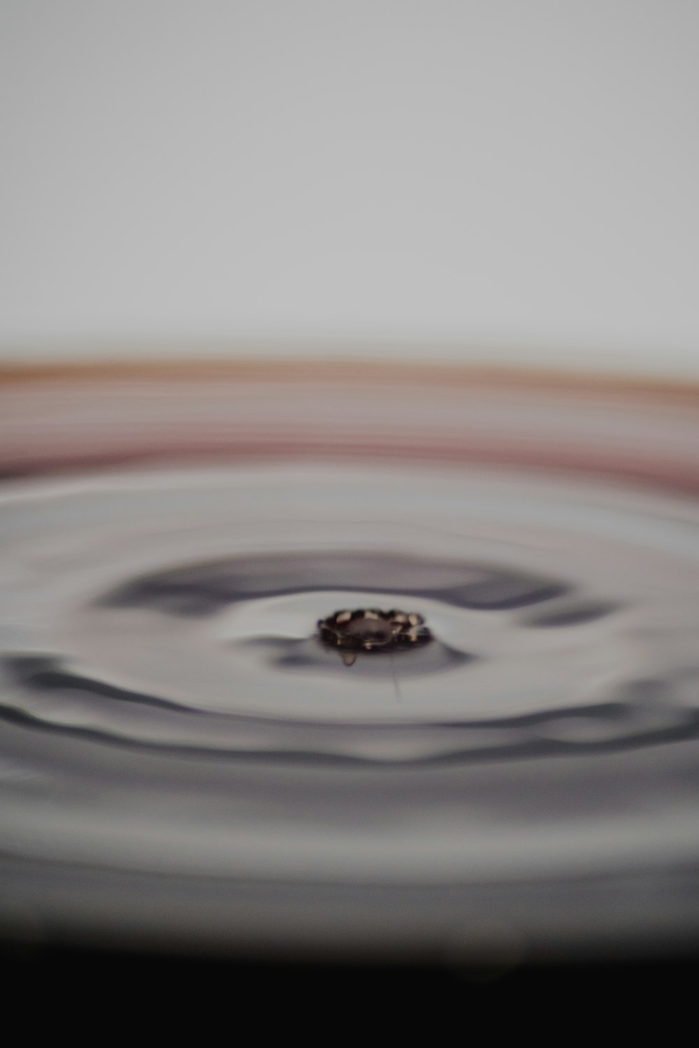 water drop on water in macro photography