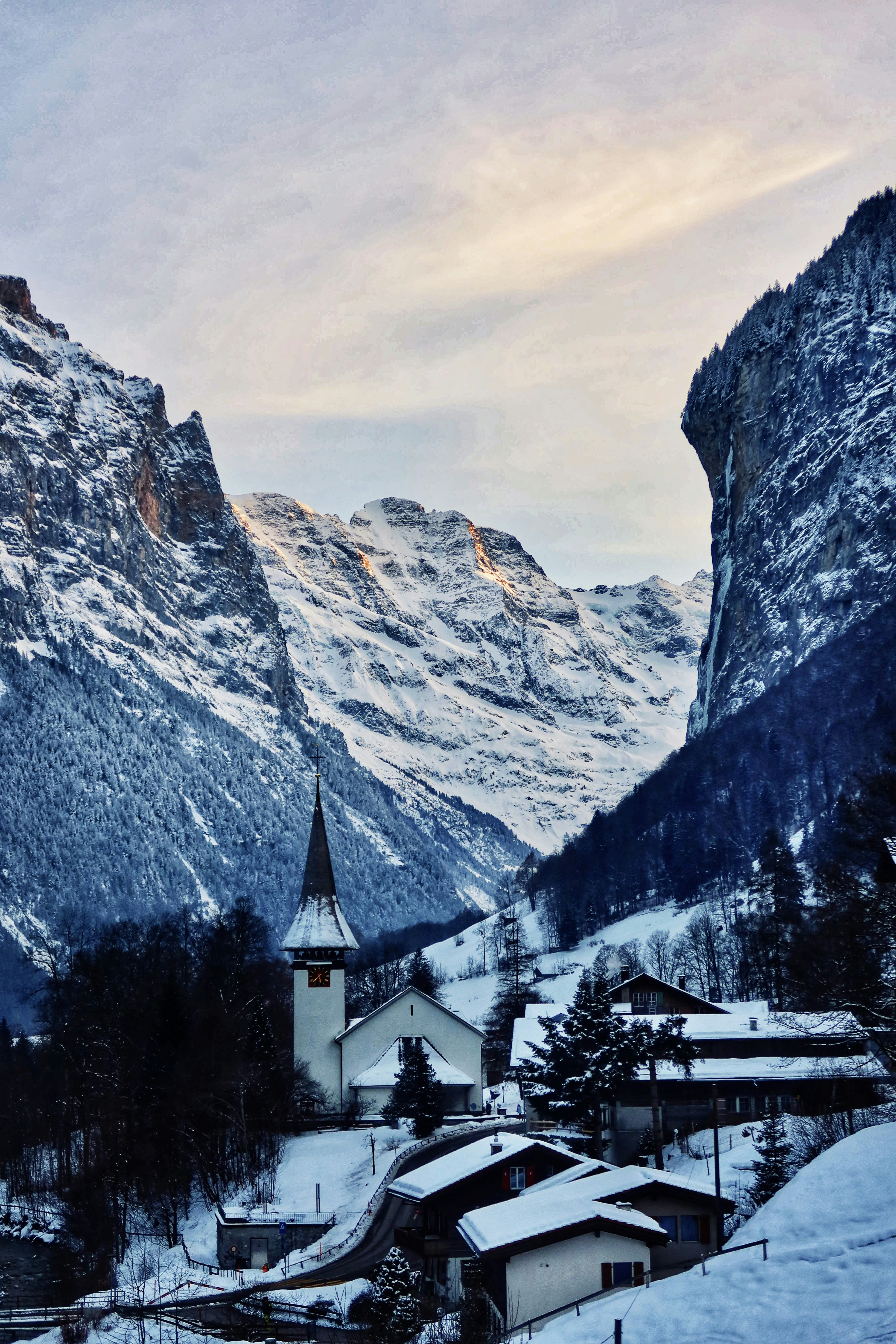 white and gray house near mountain