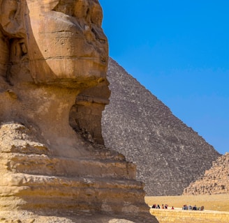 brown rock formation under blue sky during daytime