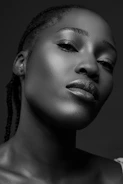 A striking portrait session with dramatic lighting highlighting the subject's confident gaze.