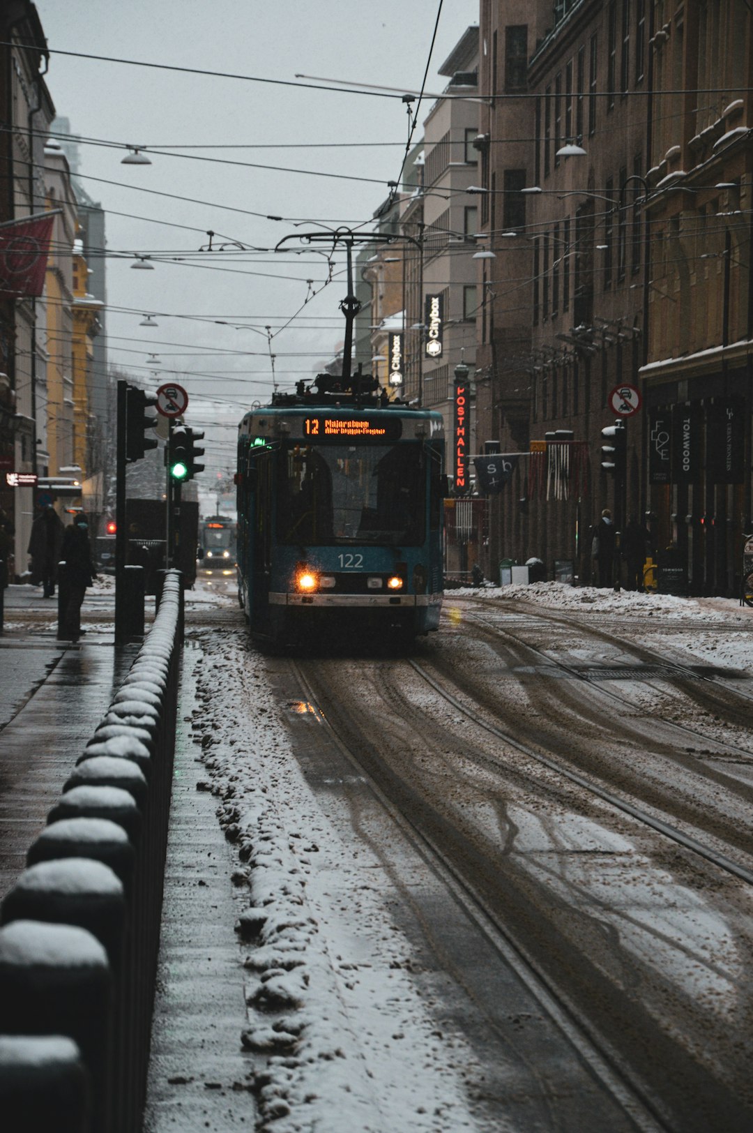 white and black tram on road during daytime