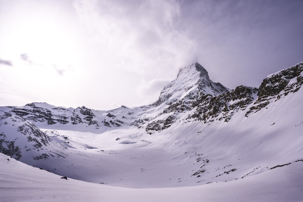 snow covered mountain during daytime