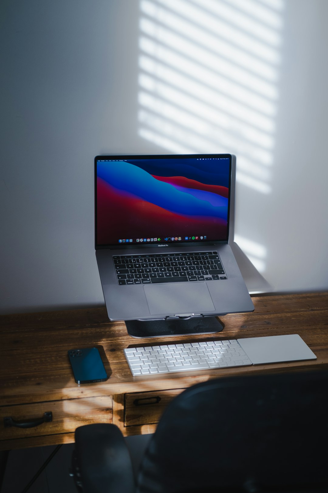 macbook pro on brown wooden table