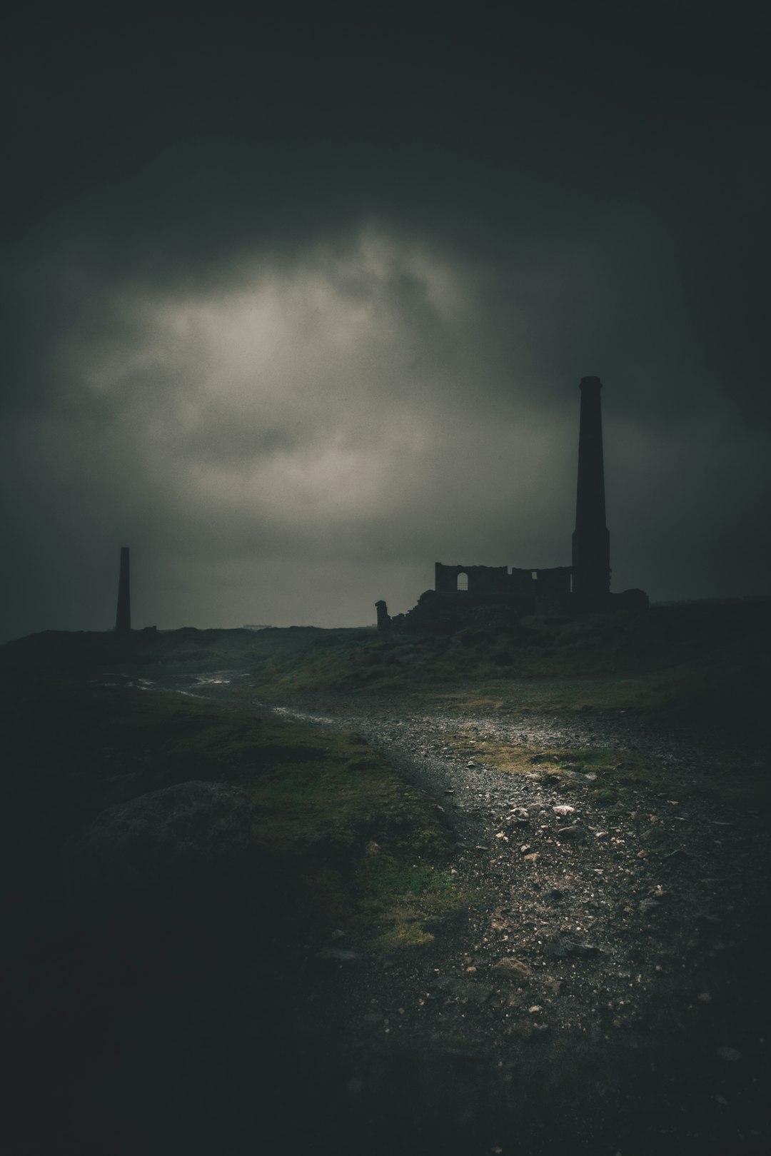 silhouette of building under cloudy sky during daytime