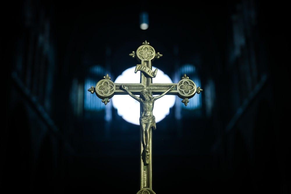 gold cross with blue light