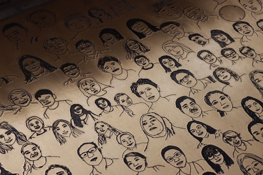 Close-up sketches of expressive human faces showing a range of emotions.