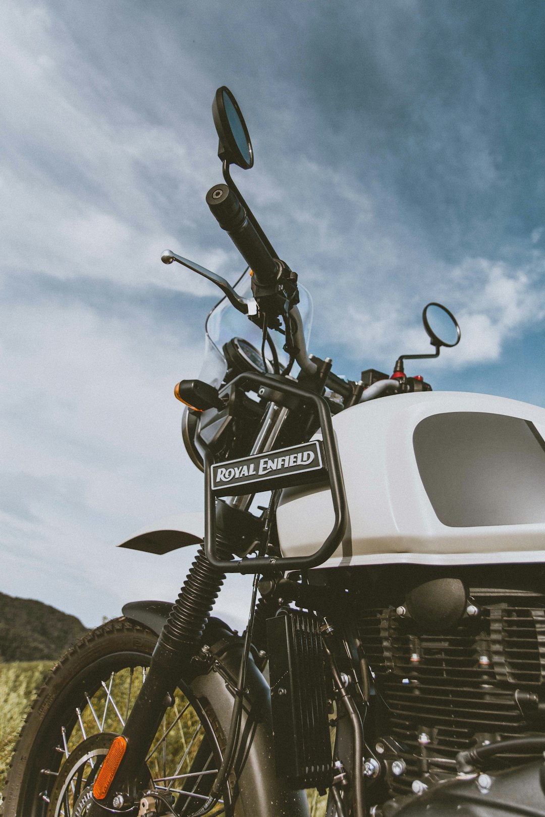 black and gray motorcycle near white car