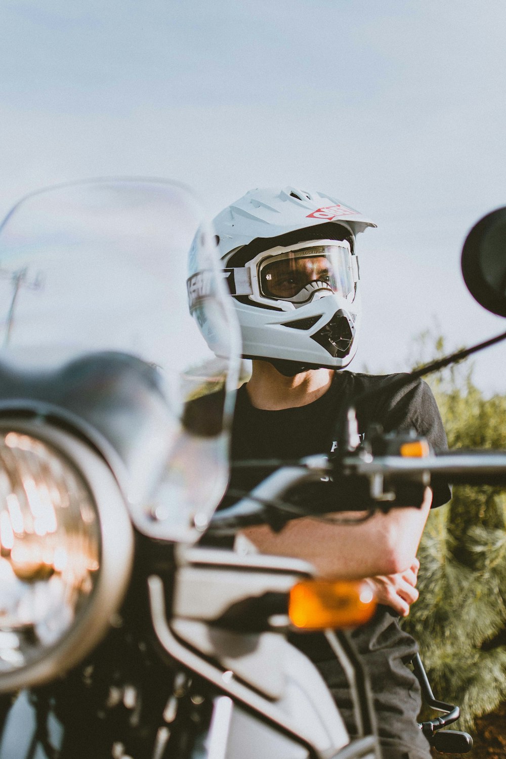 man in white helmet riding motorcycle during daytime