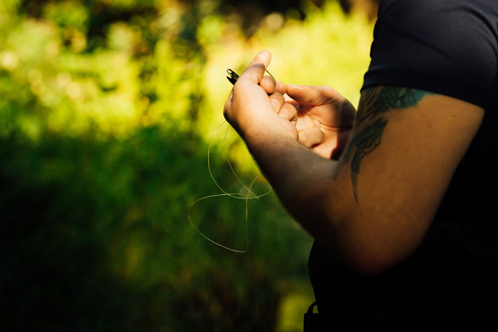 person holding black and silver key