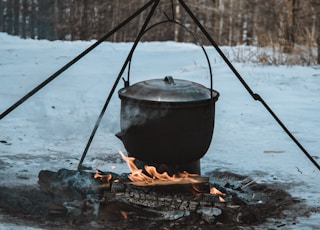 black steel pot on fire